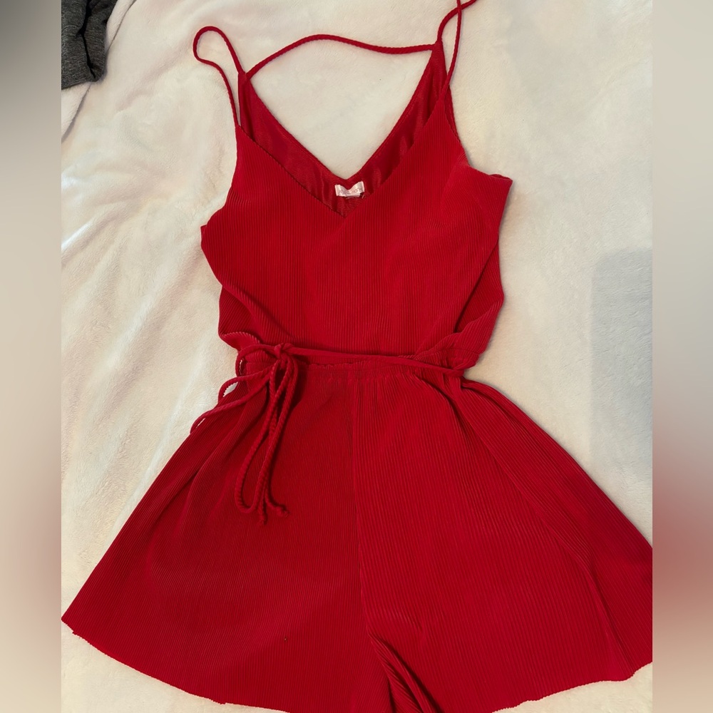 Super cute red ribbed romper with belt still in great condition barely worn.